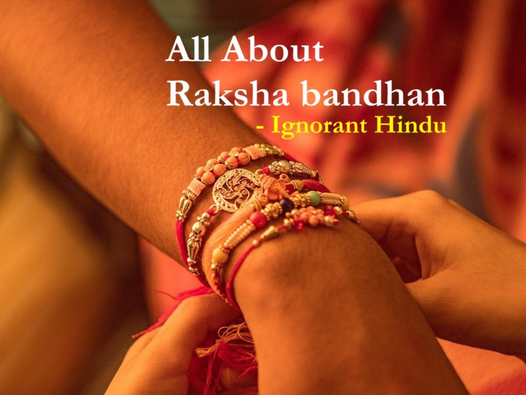 A male hand with Rakhi tied on the wrist and words reading- ALL ABOUT RAKSHA BANDHAN