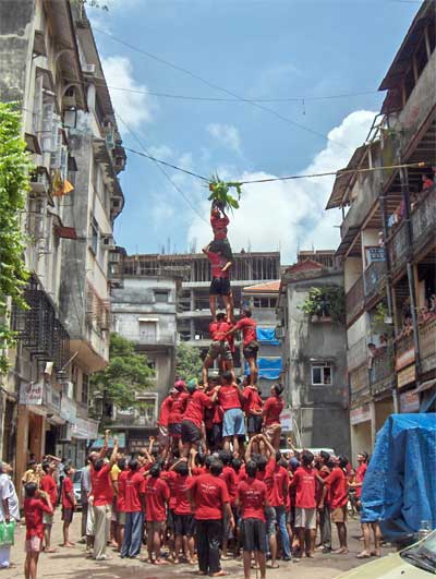 A team creating the human pyramid to reach the Dahi Handi